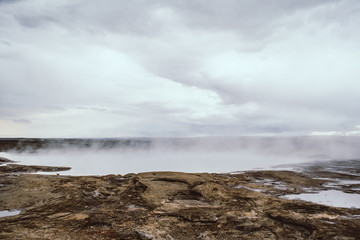 Geyser steam covering the horizon. Iceland.