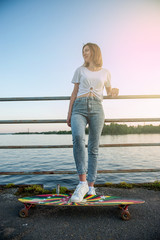 Young hipster girl with longboard