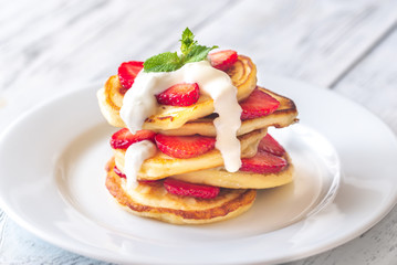 Portion of ricotta fritters with fresh strawberries
