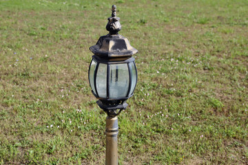 Vintage black iron lantern on a city street