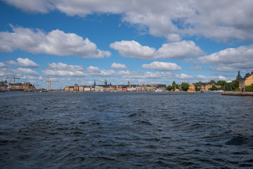 Fototapeta premium Houses and landscape at the inner harbor of Stockholm a summer day.