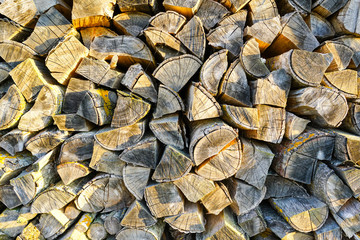 Background of wooden logs, chopped fire wood prepared for winter