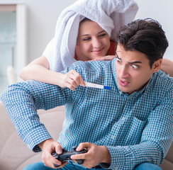 Wife and husband looking at pregnancy test