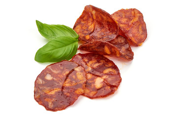 Spanish spicy Chorizo Sausage slices, close-up, isolated on white background