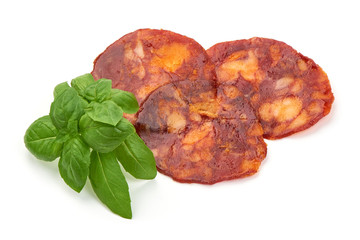 Spanish pork chorizo sausage slices, close-up, isolated on white background