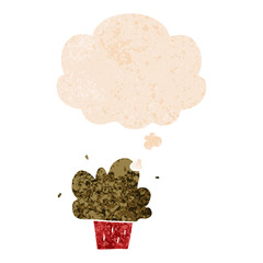 cartoon cupcake and thought bubble in retro textured style