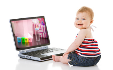 Baby: Little Girl Sits By Laptop Computer