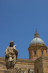 Fototapeta na wymiar Vertical view of a detail at the cathedral of Palermo Sicily, detail of the historical dome and statue