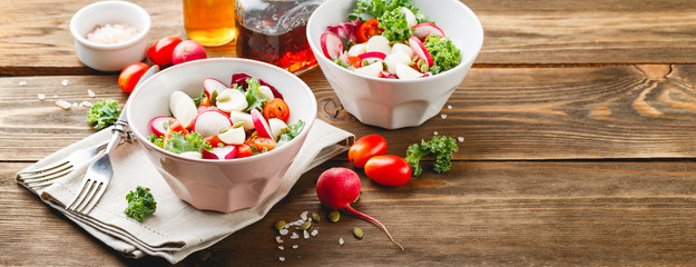 Salad with cherry tomatoes, radsh and mozzarella, lettuce mix