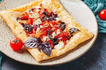 Tomato tarts with addition of aromatic herbs