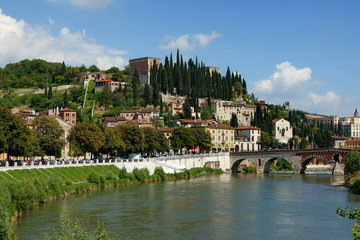 Fototapeta na wymiar Panorama of the city of Verona. Bridge over the river Adige and the hill of San Pietro.