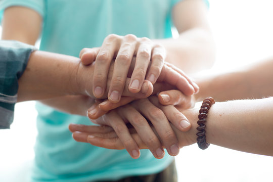 Close-up of business people hands. Unity team friends collaboration.