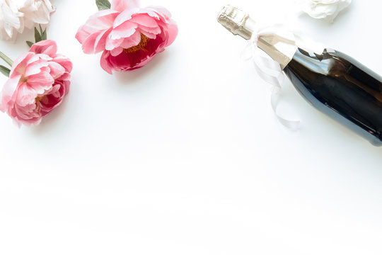 Styled flatlay - peonies & champagne