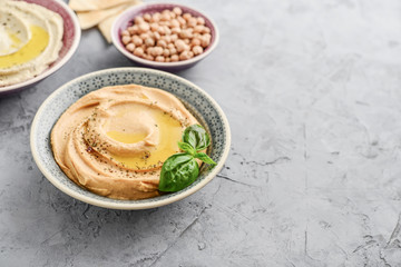 Bowls with different kinds hummus