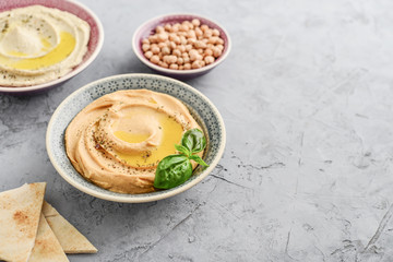 Bowls with different kinds hummus