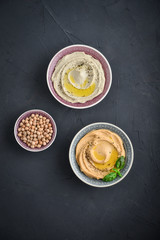 Bowls with different kinds hummus