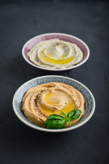Bowls with different kinds hummus