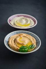 Bowls with different kinds hummus