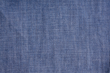 Blue denim. Cotton fabric, jeans. Creative vintage background.