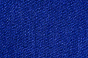 Blue denim. Cotton fabric, jeans. Creative vintage background.