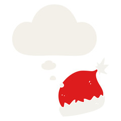 cartoon santa hat and thought bubble in retro style