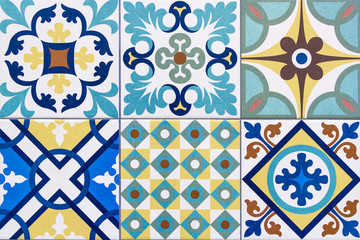 Detail of traditional portuguese tiles with colorful ornaments. Horizontal background. Detail of traditional tiles from the facade of an old house in Porto, Portugal. Traditional Portugal pottery.