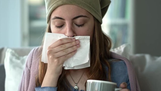 Young woman suffering from cold