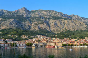 Fototapeta na wymiar View of Makarska city center from the sea. Adriatic Sea coast, Dalmatia, Croatia