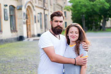 Obraz premium Enjoying togetherness. Couple in love. Couple of bearded man and sexy woman. Family couple hugging on summer outdoor. Sensual couple spending time together