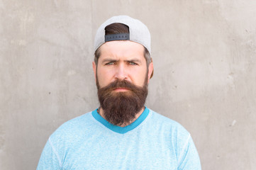 Beard and mustache grooming. Hipster lifestyle. Cool hipster with beard wear stylish baseball cap....