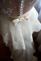 Obraz na płótnie Canvas Bride from the back in a wedding dress.