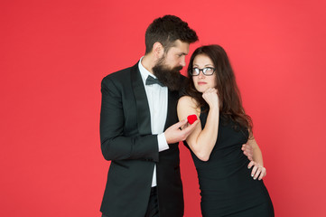 Engagement concept. Couple in love celebrate anniversary. Handsome man and elegant woman in love. Romantic engagement. Proposal engagement. Romantic gift box jewelry engagement. Marriage proposal