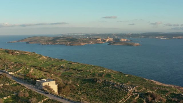 Aerial drone dolly in shot of Maltese islands, Comino (Kemmuna) , Cominito And Malta, view from the Gozo island