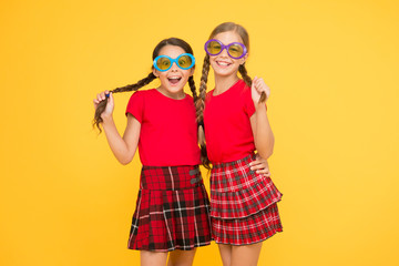 summer vacation. party time. school prom party. red fashion girls. happy little girls in checkered skirt. funny kids in school uniform. Small girls wearing fancy glasses. summer is soon. wow