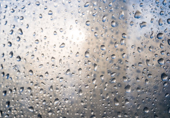 background of raindrops on window glass, close up