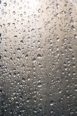 background of raindrops on window glass, close up