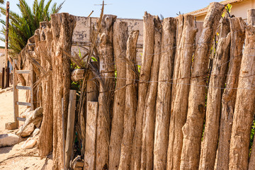 Rustic wooden fence around a house in Namibia