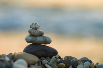 stack of zen stones on pebble beach