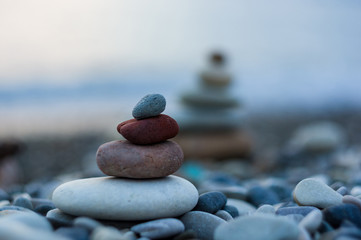 stack of zen stones on pebble beach