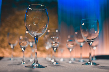 table setting with shiny wineglasses in restaurant