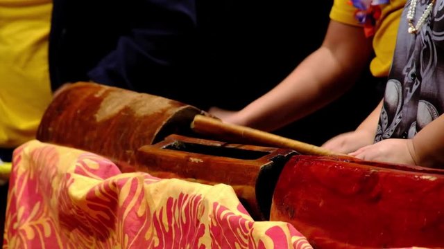 Close up shot of Pacific island drums being played at cultural festival in New Zealand.
