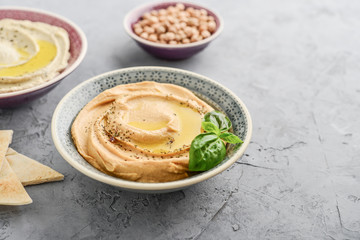 Bowls with different kinds hummus