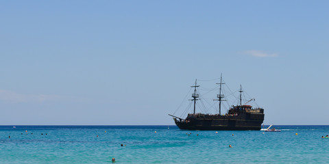 Pirate ship sailing near beach in Protaras, Cyprus on June 16, 2018. 