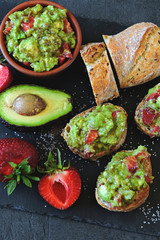 Healthy toast with strawberry guacamole.