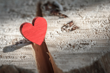 Fototapeta premium Red heart in crack. Symbol of love. Conflict in love relationships.