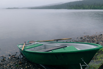 Boat in the fog on the northern lake