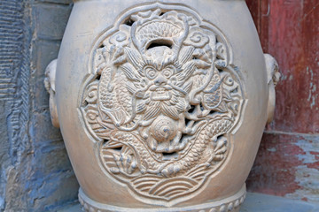 dragon head carved on the pottery
