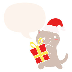 cute cartoon cat carrying christmas present and speech bubble in retro style