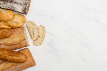 Wholegrain, white and brown bread on white background