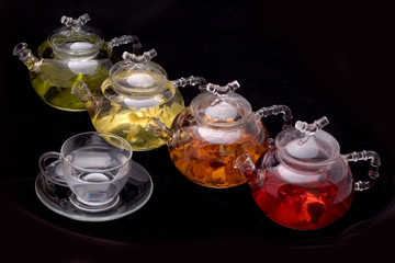 glass teapot and mug on black background - 276016692